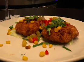 Irvin Mayfield's Jazz Playhouse signature dishes Bourbon St. Wings
Louisiana Crab Cakes
Chicken And Waffles